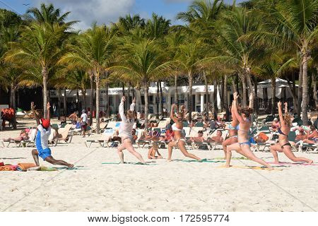 Playa del Carmen Mexico - January 28 2017: Keep fit exercise class on caribbean beach