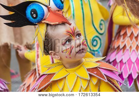 Portrait of kid at parade costumed characters through the streets of the city. FEBRUARY 17 2015 Torrevieja Spain.