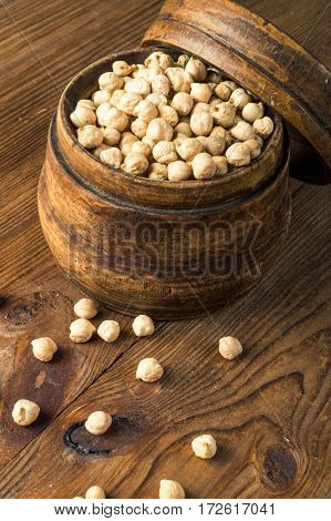 Portion of Chick Peas in wooden bowl.