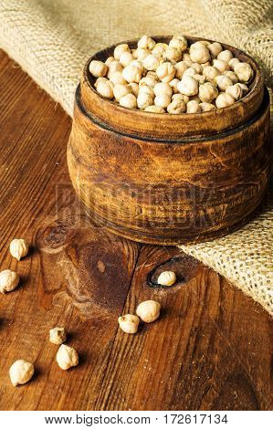 Portion of Chick Peas in wooden bowl.