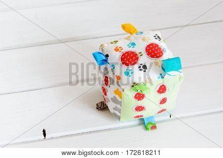 handmade toy dice pillow on white background with copy space