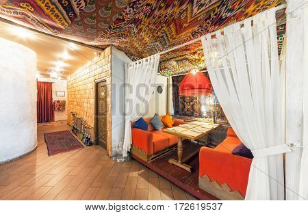 MOSCOW - AUGUST 2014: Interior Chaihana Lounge Eastern restaurant in a traditional style. Cozy private cabin in oriental style