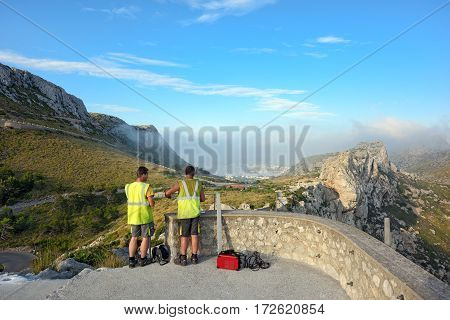 MAJORCA/ SPAIN - JUNE 13. Workers build the observation platform Mirador Colomer on the rocks on June 13, 2016. Cape Formentor, Island Majorca, Spain.