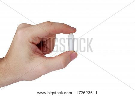 Rectal candle in hand on white background