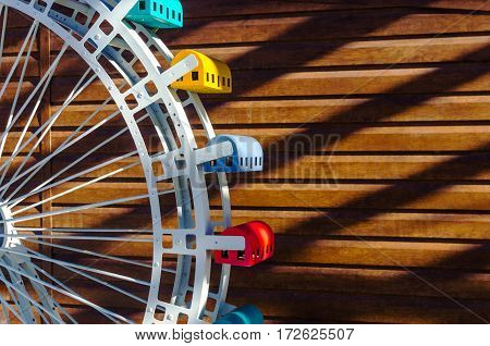 Layout part ferris wheel on a wooden background with free space