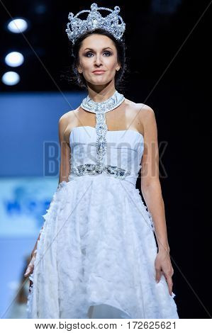 MOSCOW RUSSIA - OCTOBER 19 2016: Model walk runway for WORLD RUSSIAN BEAUTY catwalk at Spring-summer 2017 Moscow Fashion Week. Clothes in national ethnic style.