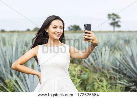 Mexican Woman In A Landscape Of Tequila.