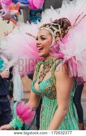 Portrait of young girl at parade costumed characters through the streets of the city. FEBRUARY 19 2017 Torrevieja Spain.