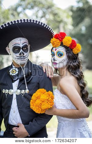 Bridal Couple With Makeup And Costumes Typical Mexican In A Cementery.