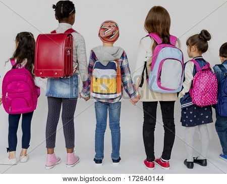 Group of Schoolers Kids with Backpack Behind Rear View on White Blackground