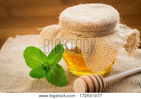 Bank Of Honey With A Spoon For Honey