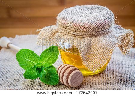 Bank Of Honey With A Spoon For Honey