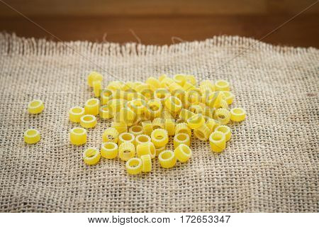Pasta Rings On Sacking On Wooden Background