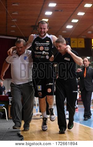 KAPOSVAR, HUNGARY - FEBRUARY 4: Ismet Sejfic (c) injured at Hungarian Championship basketball game with Kaposvar (white) vs. Pecsi VSK (black) on February 4, 2017 in Kaposvar, Hungary.