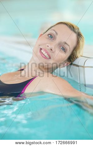 Blond woman relaxing in spa pool