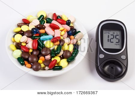 Glucometer With Result Sugar Level And Heap Of Medical Pills And Capsules, Diabetes, Health Care Con