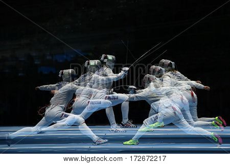 RIO DE JANEIRO, BRAZIL - AUGUST 13, 2016: Sofya Velikaya of Russia (L) and Mariel Zagunis of United States compete in the Women's Sabre Team of the Rio 2016 Olympic Games at Carioca Arena 3