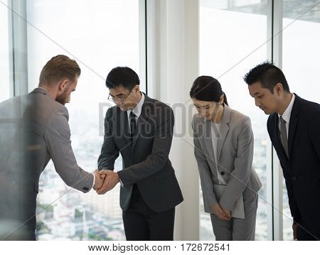 Business Partners Introductionary Handshake Bow