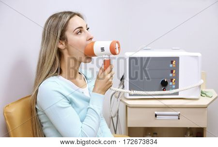 Young woman undergoing treatment in modern clinic
