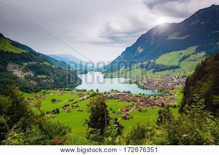 Fine view aerial on the resort town Lungern. Popular tourist attraction. Dramatic and picturesque scene. Location place Swiss Alps, canton of Obwalden, Europe. Discover the world of beauty.