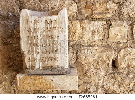 Latin inscritption on ancient stone Tarraco Tarragona.
