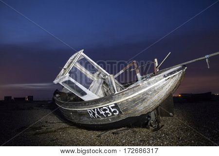 Shipwreck in the dusk on England`s coastline
