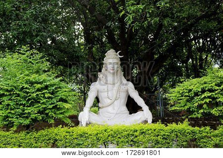 Statue of Hindu Lord Shiva under the tree, Rishikesh, India