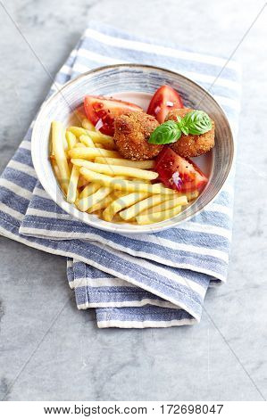 Frikadeller with french fries and tomatoes