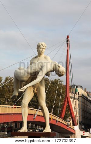 Lyon, France - November 12, 2016: The weight of One Self sculpture by Michael Elmgreen and Ingar Dragset in the front of Bridge of the Palace of Justice in Lyon, France