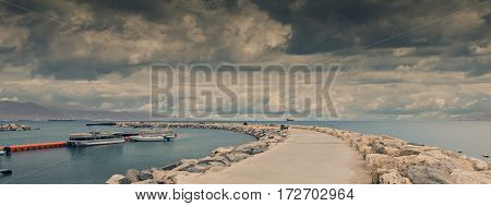 Panoramic view on a public stone pier at the cental beach of Eilat - famous resort city in Israel