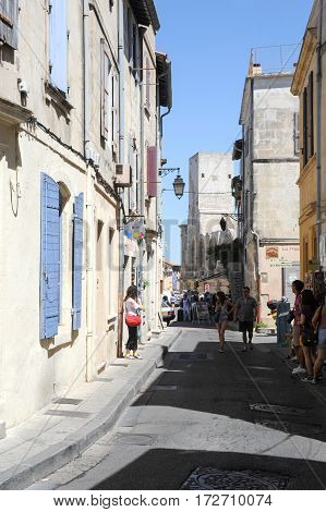 Tourists Walking In The Narrow Streets Of Arles