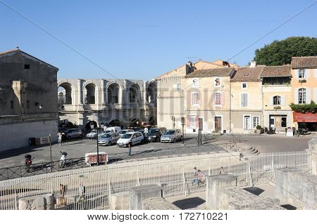People Walking In Front Of The Amphithater At Arles