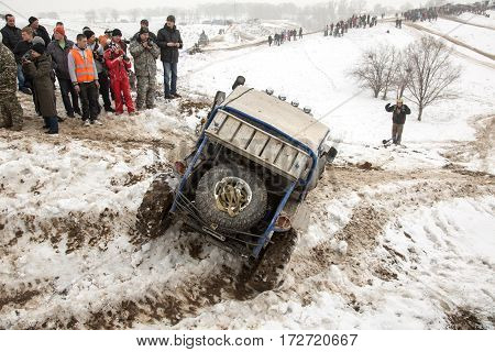 ALMATY KAZAKHSTAN - FEBRUARY 21 2013: Off-road racing on jeeps Car competition ATV. Traditional race 