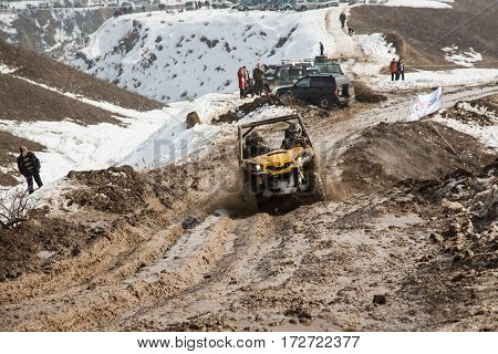 ALMATY KAZAKHSTAN - FEBRUARY 21 2013: Off-road racing on jeeps Car competition ATV. Traditional race 