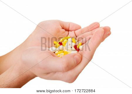 Person hold a Pills in the Hands Isolated on the White Background closeup