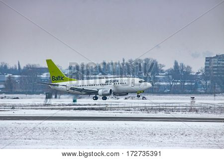 Borispol Ukraine - January 6 2011: airBaltic Boeing 737 landing on a cold winter day