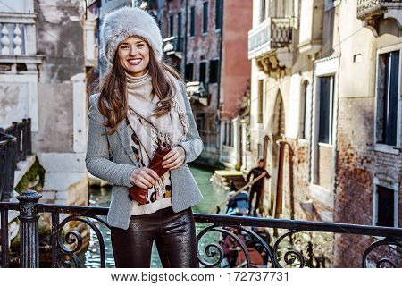 Smiling Trendy Traveller Woman In Venice, Italy In Winter