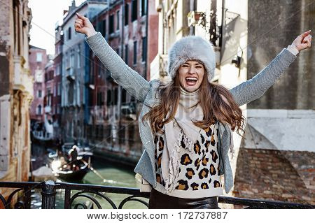 Smiling Traveller Woman In Venice, Italy In Winter Rejoicing