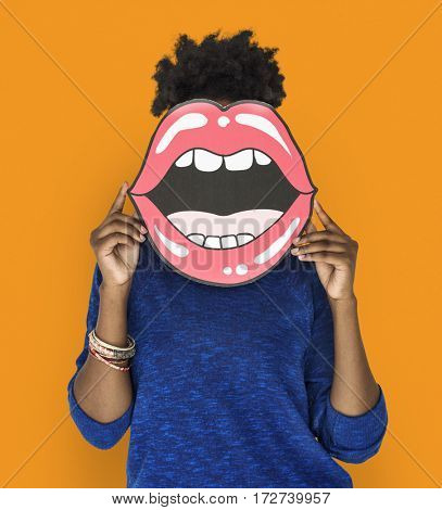 African Woman holding Peper Mouth Over her Face