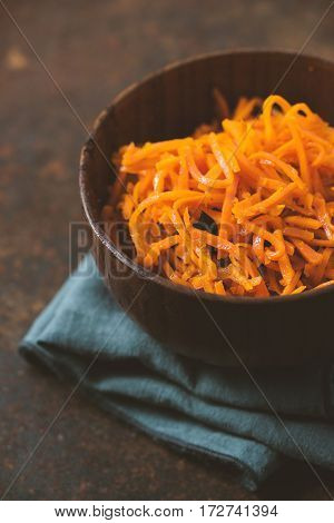 Asian korean carrot salad with spices and garlic vertical