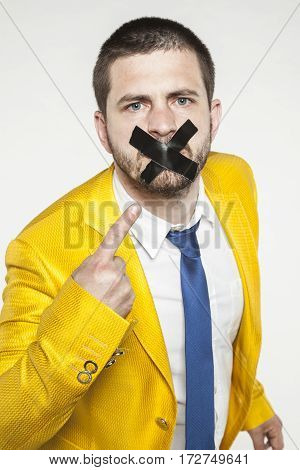 Businessman Shows His Sealed Lips, A Conspiracy Of Silence