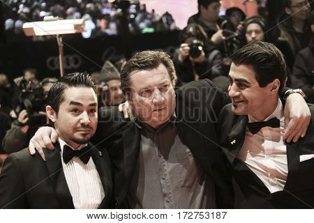 Sherwan Haji, director Aki Kaurismaki, Simon Hussein Al-Bazoon arrive for the closing ceremony of the 67th Berlinale  Festival Berlin at Berlinale Palace on February 18, 2017 in Berlin, Germany.