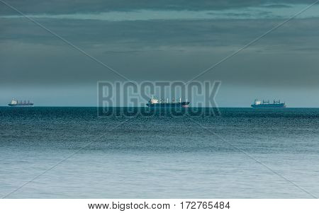 Transportation cargo conteiner ships sailing in still water heading for the port