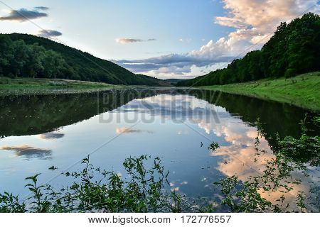 A quiet evening is on the river