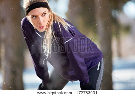 Breathless girl make short break from running 