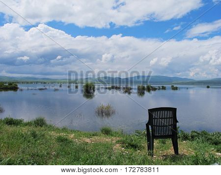 empty chair isolated in a croatian breathtaking lake