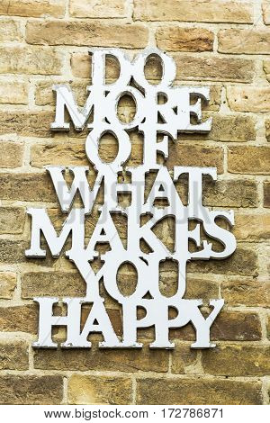 Do More Of What Makes You Happy Motivation Quote on a wall