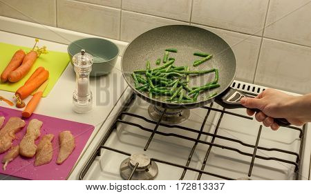 cooking at home kitchen chicken carrot and green beans