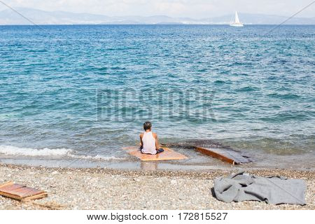 KOS ISLAND, GREECE - SEP 28, 2015: Unknown refugees arriving in Greece by inflatable boats from Turkey. Kos island is located just 4 kilometers from the Turkish coasts.