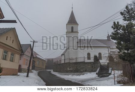 Fog Morning In Spisske Tomasovce Winter Village
